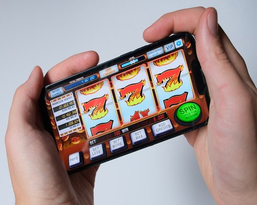 Smartphone displaying the fictional Outback Turbo Unit arcade game